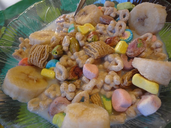 St Patty's Day Lucky Charms Breakfast- Lucky Charms, Quakers Oatmeal Squares, pistachios, frozen banana slices, and fat free milk